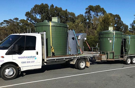 service-commercial septic tanks on truck being delivered